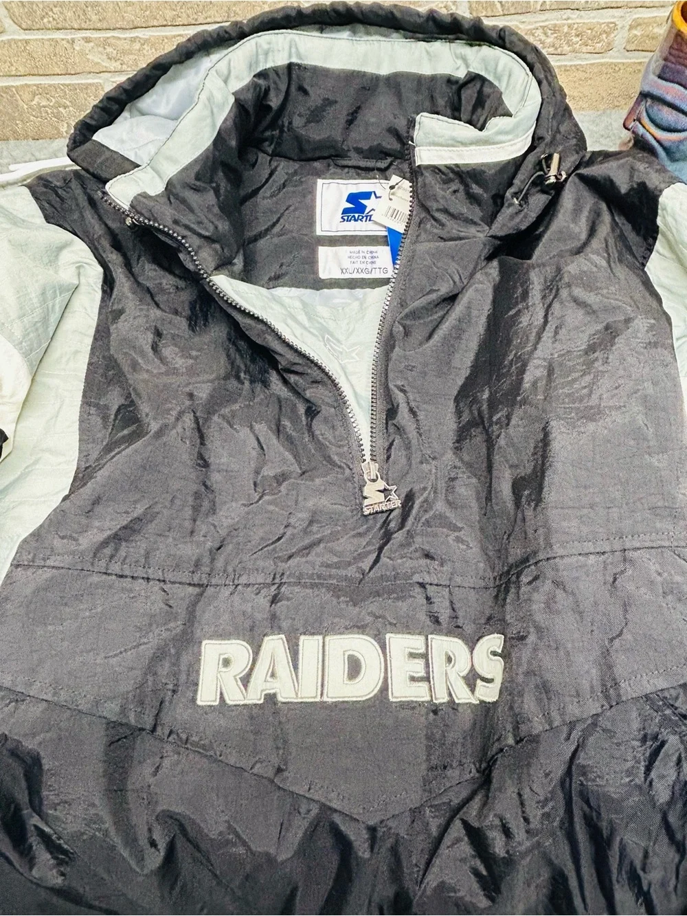 Vintage 90s Starter Oakland Raiders NFL Puffer Jacket Pullover Pouch Black